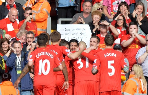 CAN'T GET ENOUGH: Liverpool's Luis Suarez (centre) celebrates scoring his team's second goal against Tottenham Hotspurs. Liverpool won 4-0 to go top of the English Premier League. AFPpic
