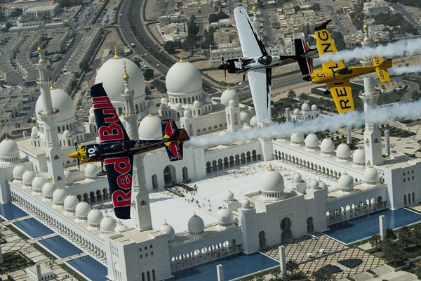 Kirby Chambliss and Michael Goulian of the United States and Nigel Lamb of Great Britain fly in formation over the Sheikh Zayed Mosque prior to the first stop of the Red Bull Air Race World Championship in Abu Dhabi, United Arab Emirates on February 26, 2014. // Jörg Mitter/Red Bull Content Pool // P-20140226-00543 // Usage for editorial use only // Please go to www.redbullcontentpool.com for further information. //