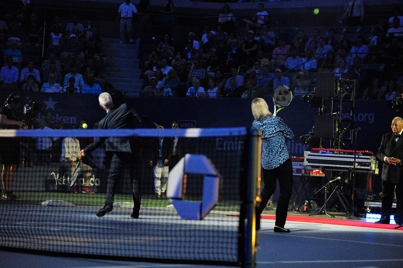 Martina Navratilova and John McEnore hit tennis balls into the stands during the Opening Ceremony on Arthur Ashe Stadium. - Photo Credit: Andrew Ong/usopen.org